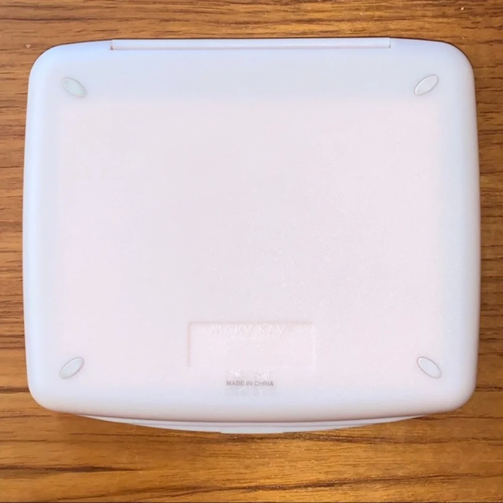Mary Kay pink plastic compact travel mirror.